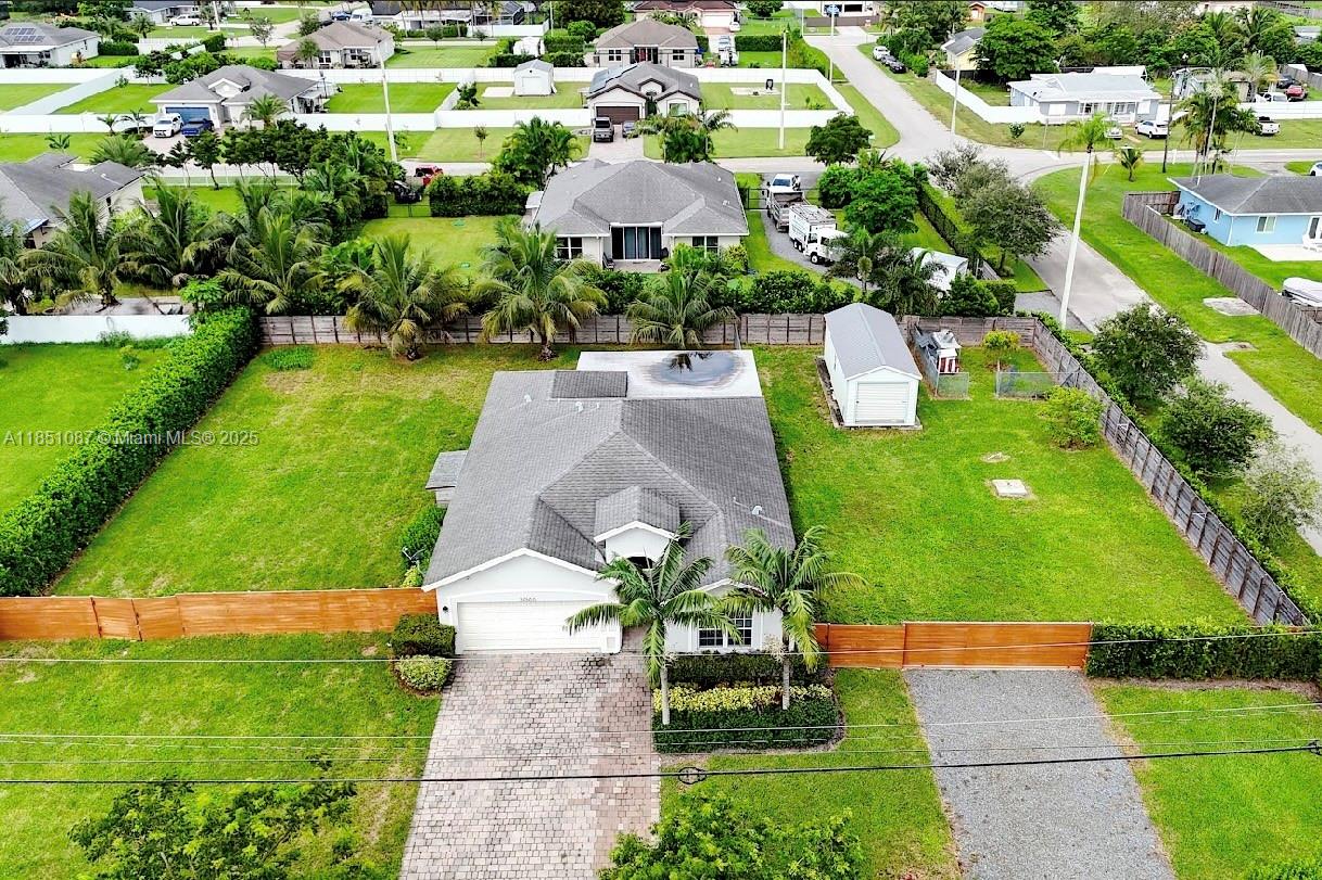 30600 Southwest 193rd Avenue Homestead, FL 33030 - Photo 33 of 36 an aerial view of residential houses with outdoor space and street view