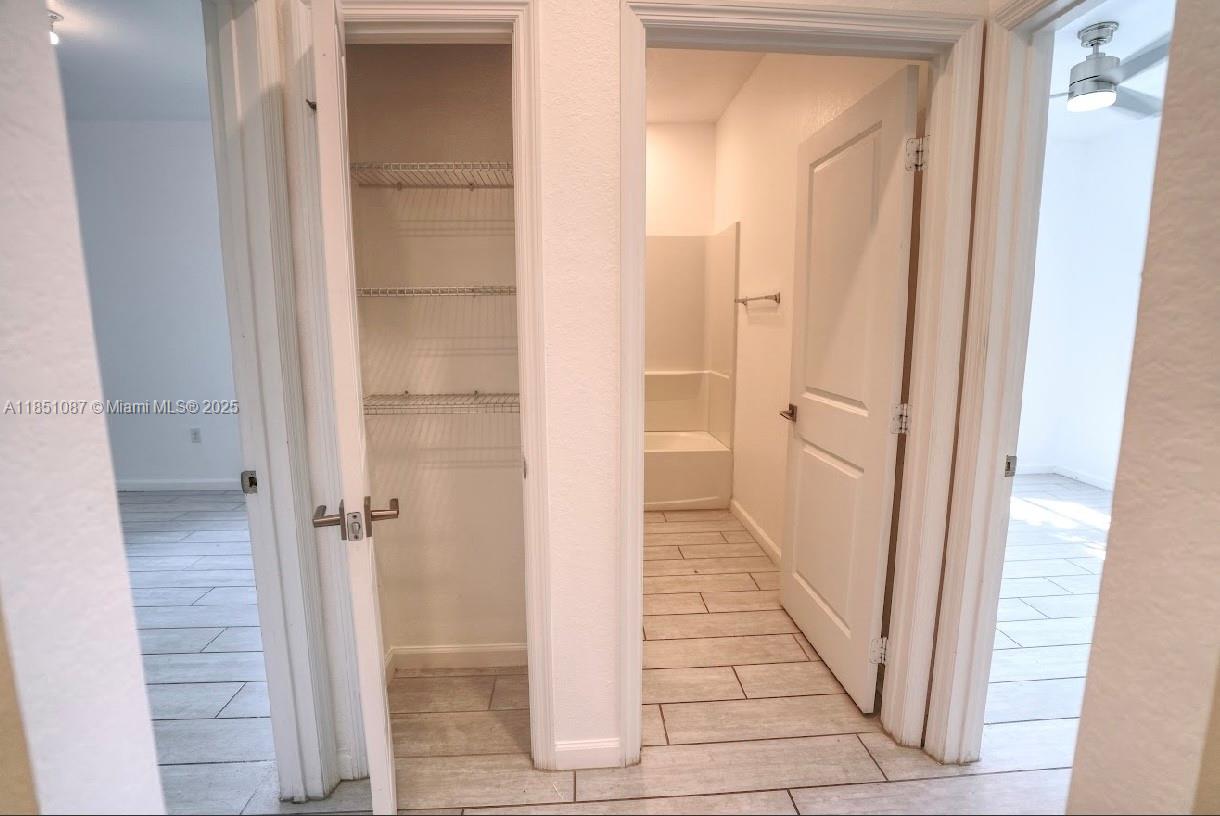 30600 Southwest 193rd Avenue Homestead, FL 33030 - Photo 5 of 36 a view of a bathroom from a hallway