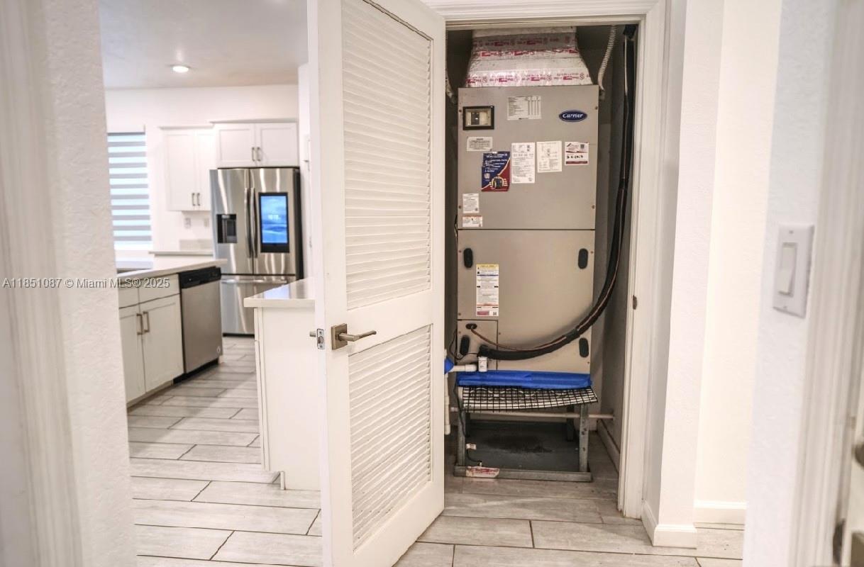 30600 Southwest 193rd Avenue Homestead, FL 33030 - Photo 7 of 36 a bathroom with a sink and a mirror