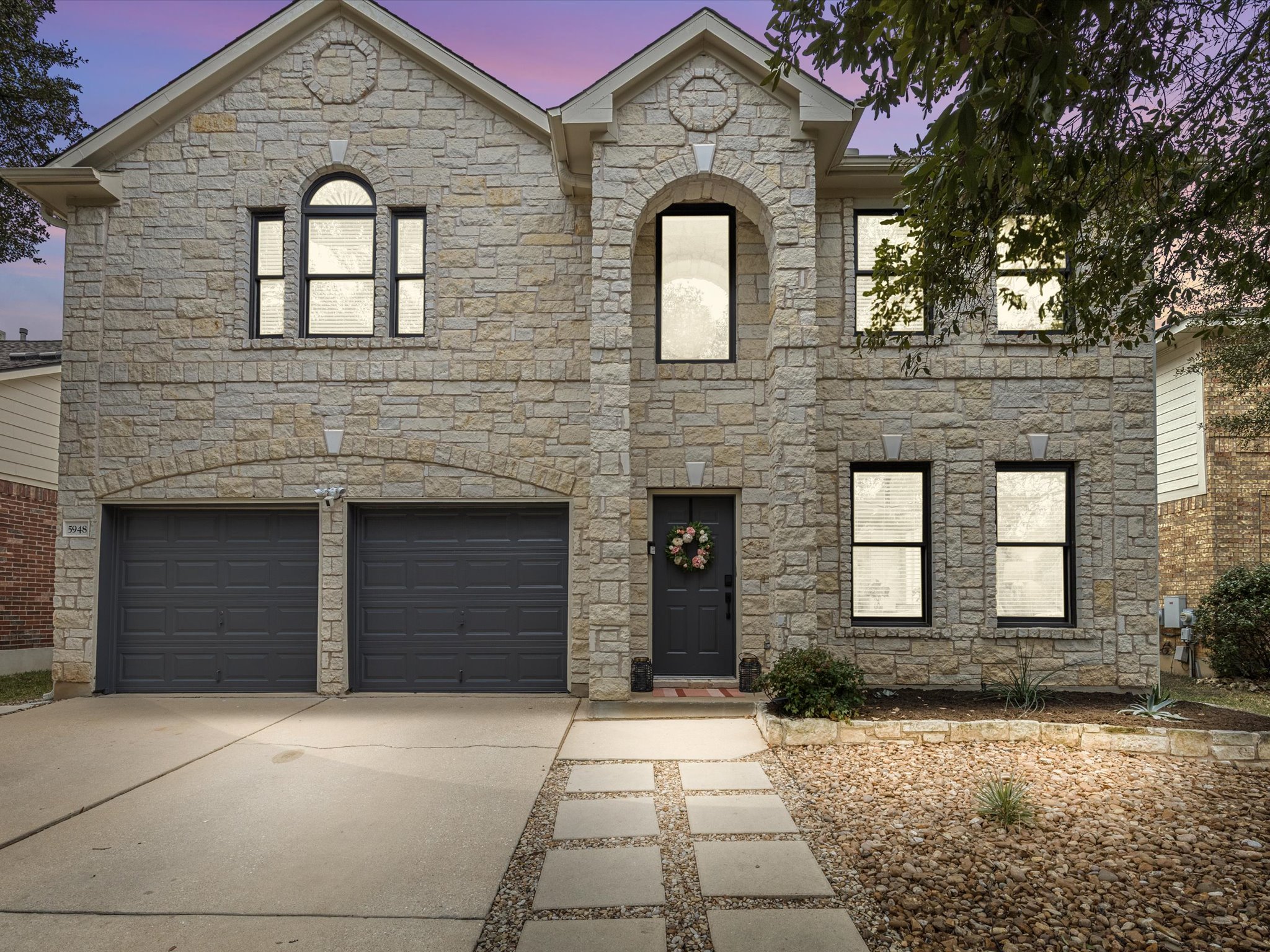 Thoughtfully updated and move-in ready modern living in South Austin's Village at Western Oaks.
