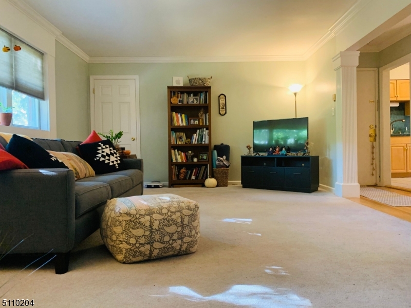 2467 Highway 10, Unit 5B Morris Plains, NJ 07950 - Photo 4 of 12 a living room with furniture and a flat screen tv