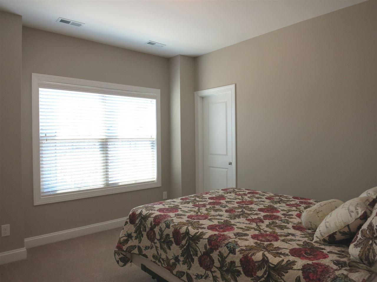 3916 Rock Rose Lane Raleigh, NC 27612 - Photo 16 of 25 There are 2 add’l lg Bedrooms on this level and each have WICs & neutral carpet. This is Bedroom 2. Bedroom