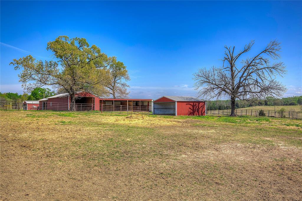7359 Highway 154 Sulphur Springs, TX 75482 - Photo 36 of 40 View of 50X24 Equipment Shed and 84X24 Storage and Shop with electricity and roll-up doors