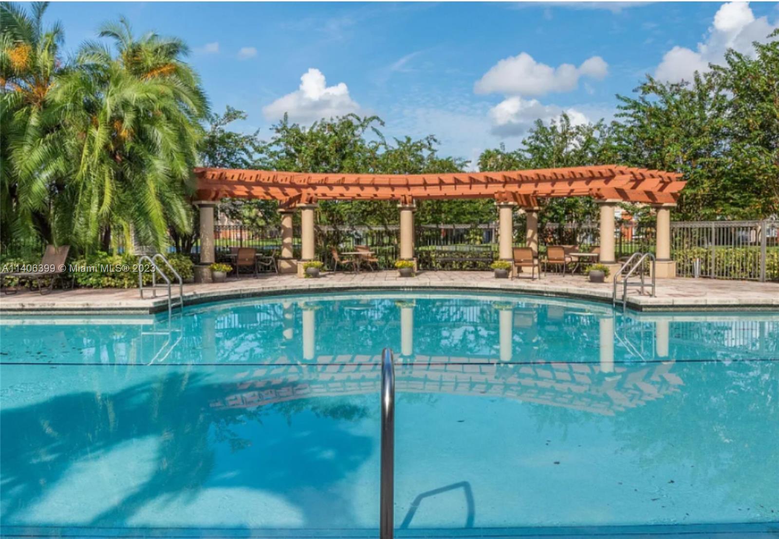 4155 Haverhill Road, Unit 1418 West Palm Beach, FL 33417 - Photo 3 of 13 a view of a swimming pool with a patio