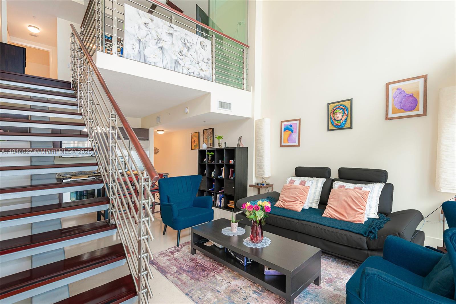 41 Southeast 5th Street, Unit 1503 Miami, FL 33131 - Photo 13 of 27 a living room with furniture and wooden floor