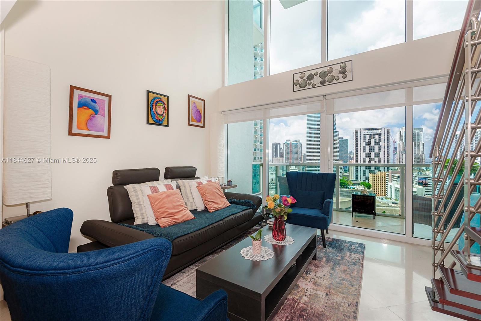 41 Southeast 5th Street, Unit 1503 Miami, FL 33131 - Photo 9 of 27 a living room with furniture and a rug