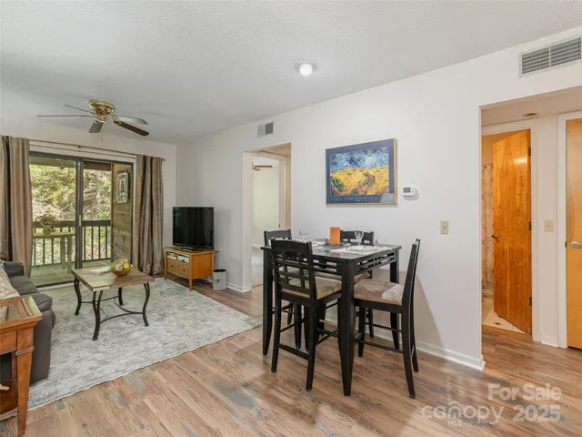 a view of a livingroom with furniture and a window