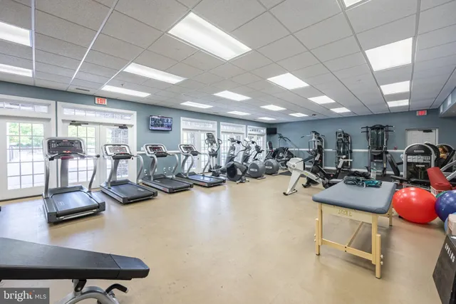 an aerial view of a house with pool yard and outdoor seating