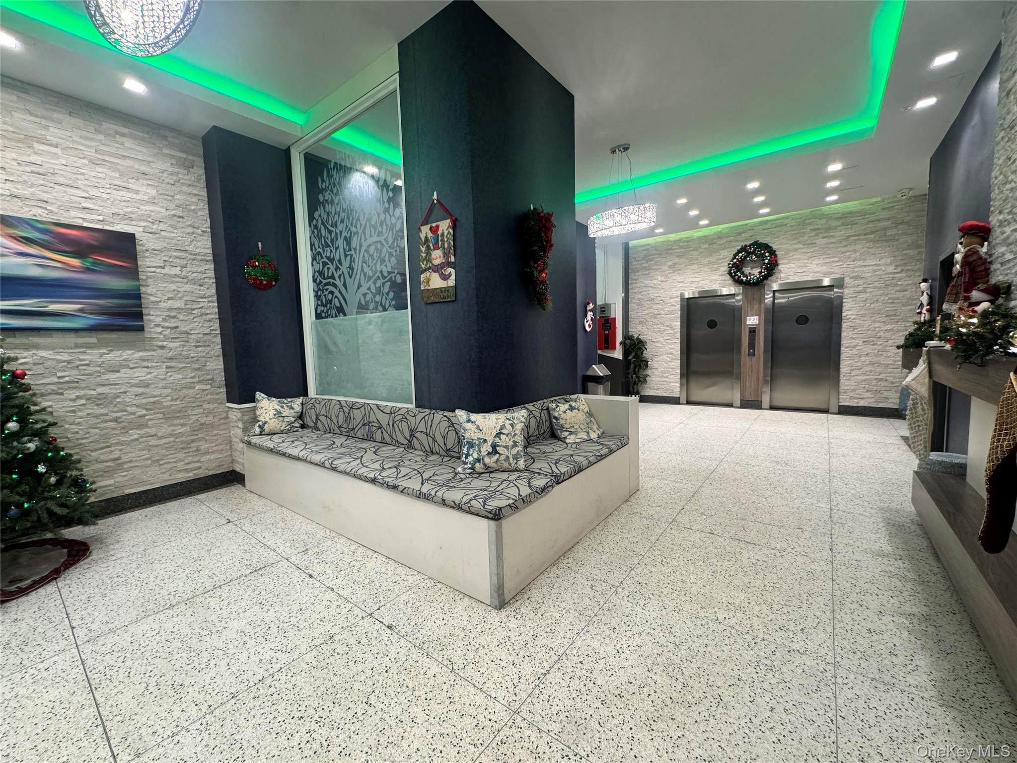 43 Bronx River Road, Unit 6C Yonkers, NY 10704 - Photo 11 of 12 a living room with furniture and a potted plant