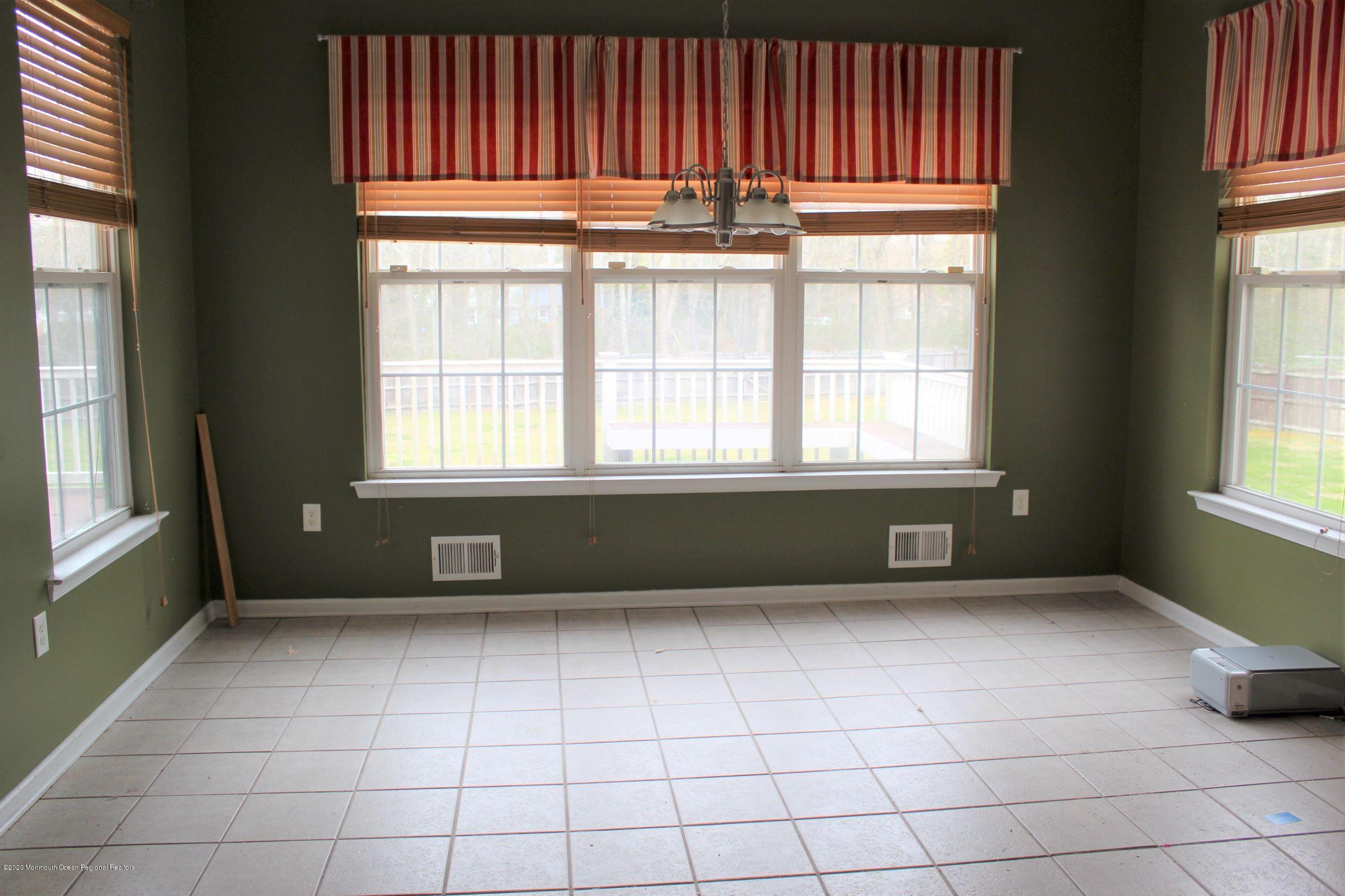 211 Cassville Road Jackson, NJ 08527 - Photo 14 of 58 a view of an empty room with a window