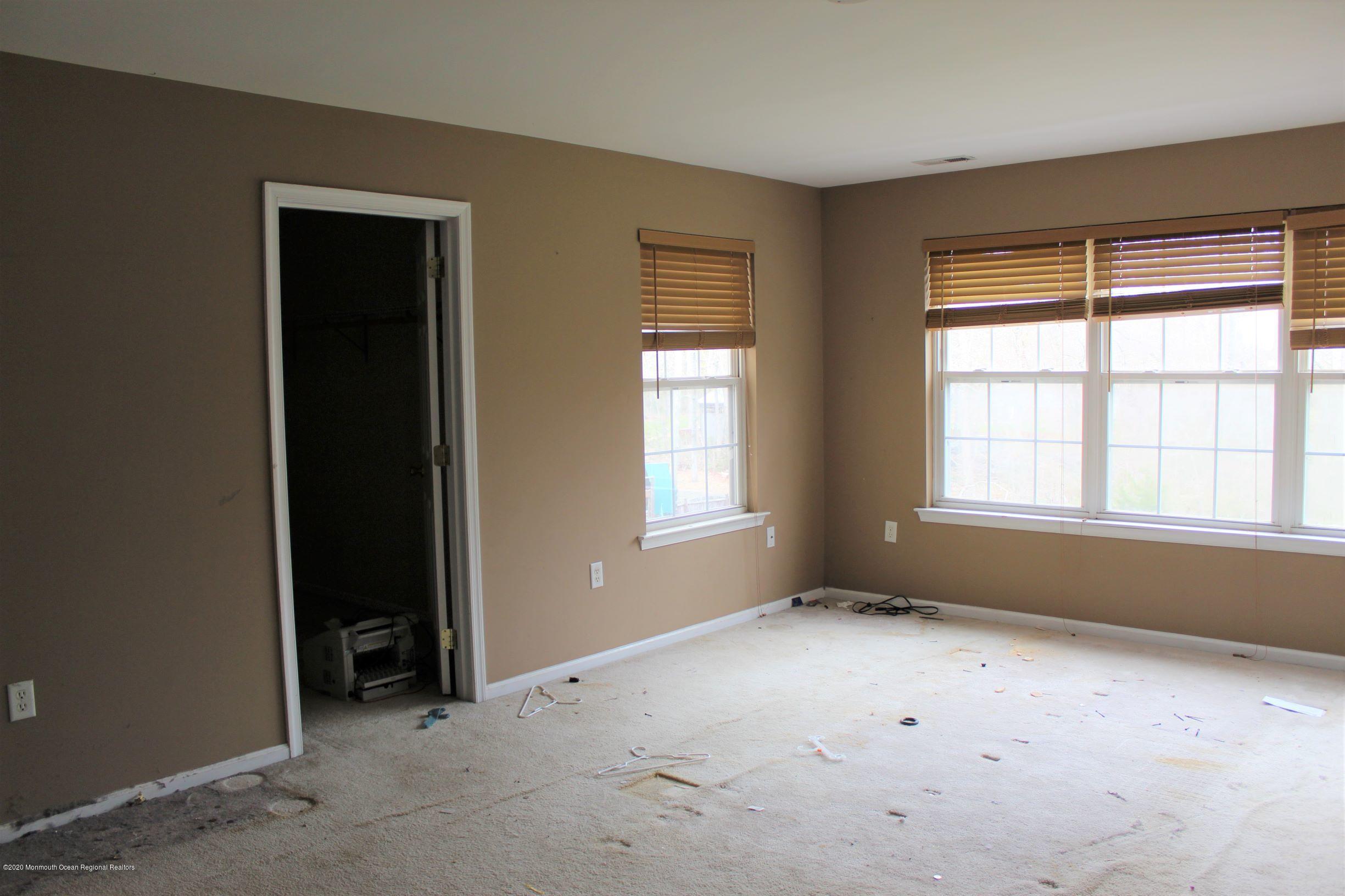 211 Cassville Road Jackson, NJ 08527 - Photo 33 of 58 a view of an empty room with a window