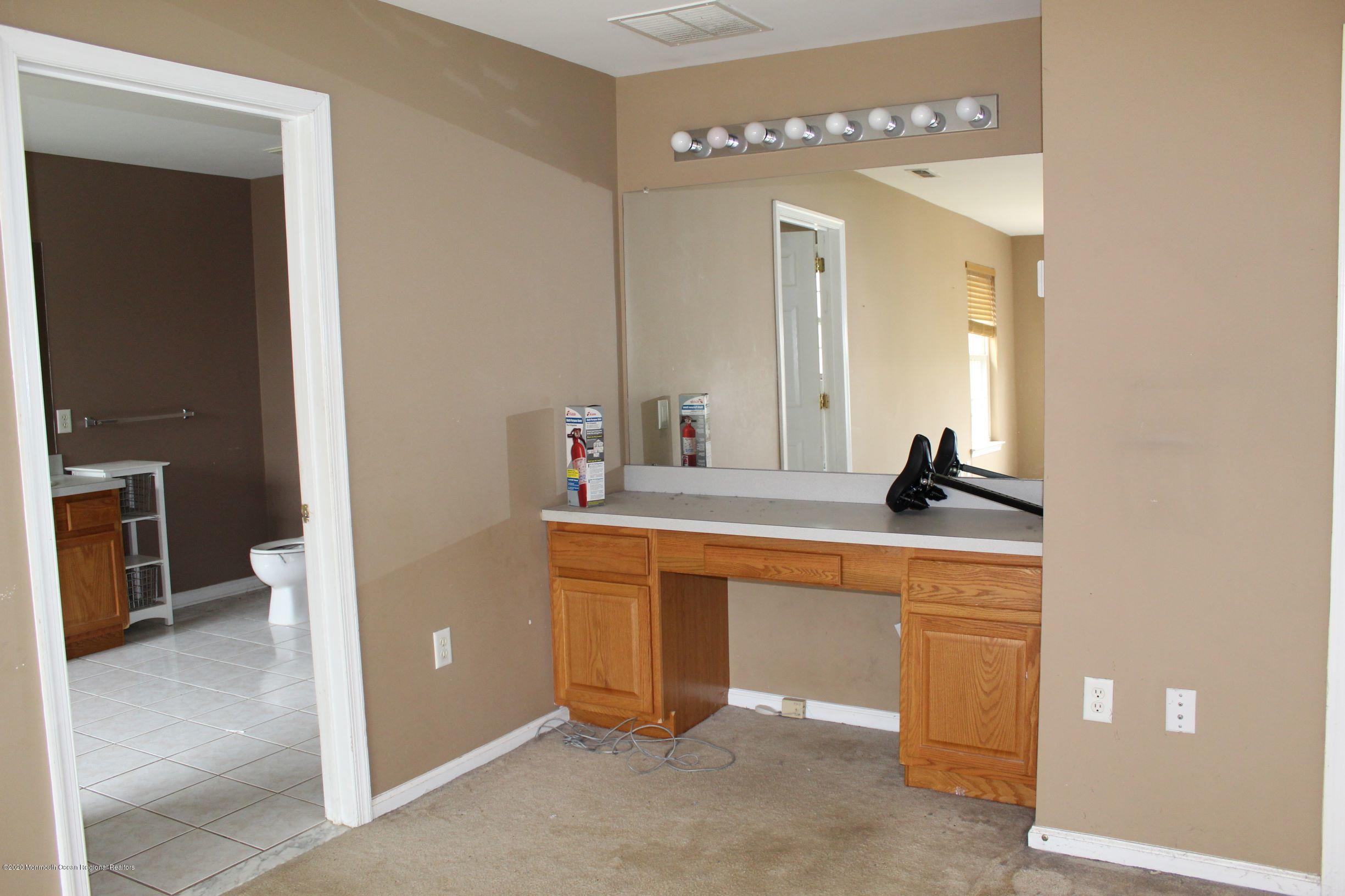 211 Cassville Road Jackson, NJ 08527 - Photo 34 of 58 a spacious bathroom with a double vanity sink and a mirror