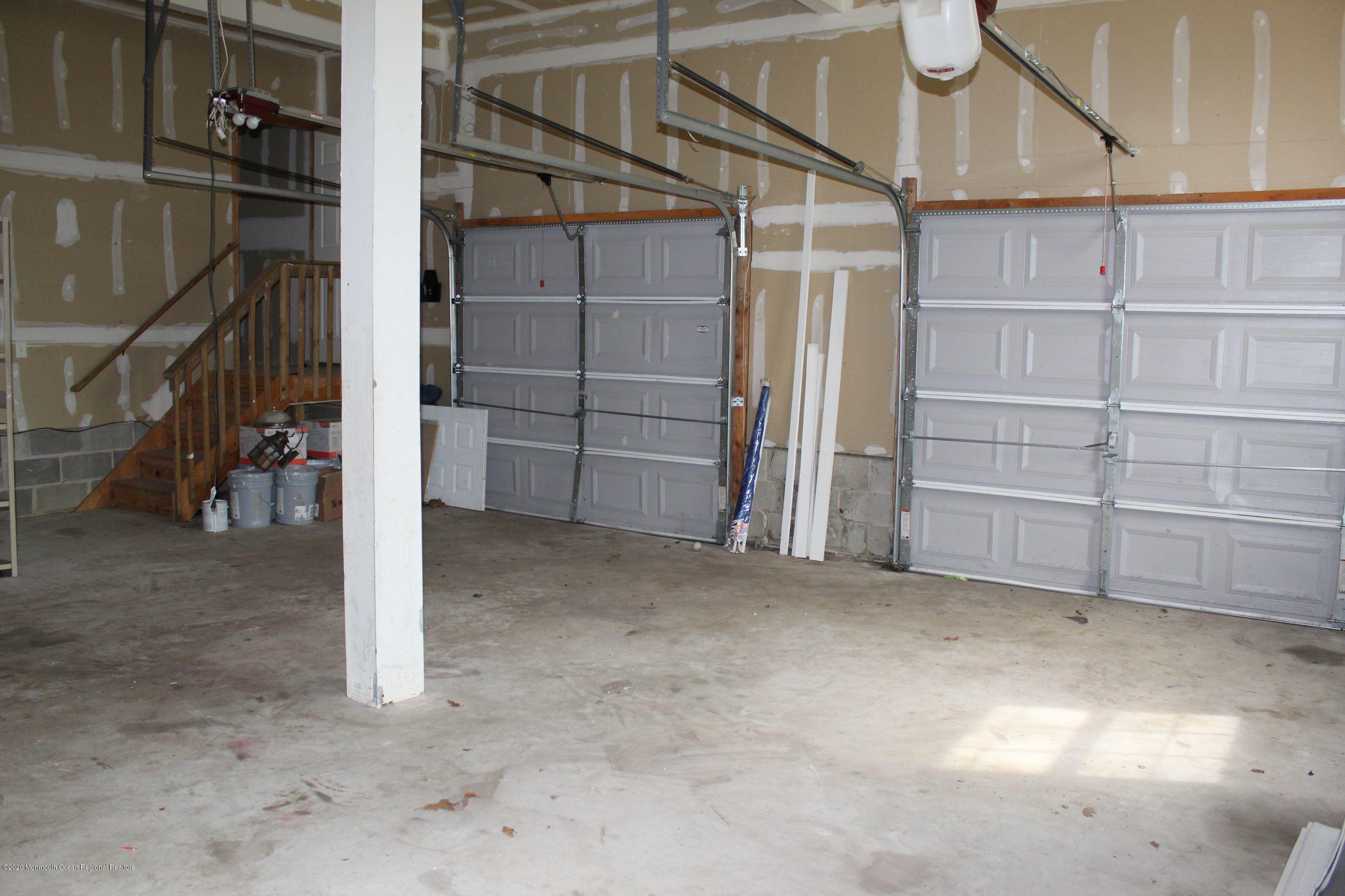 211 Cassville Road Jackson, NJ 08527 - Photo 46 of 58 a view of an empty room with racks on the wall