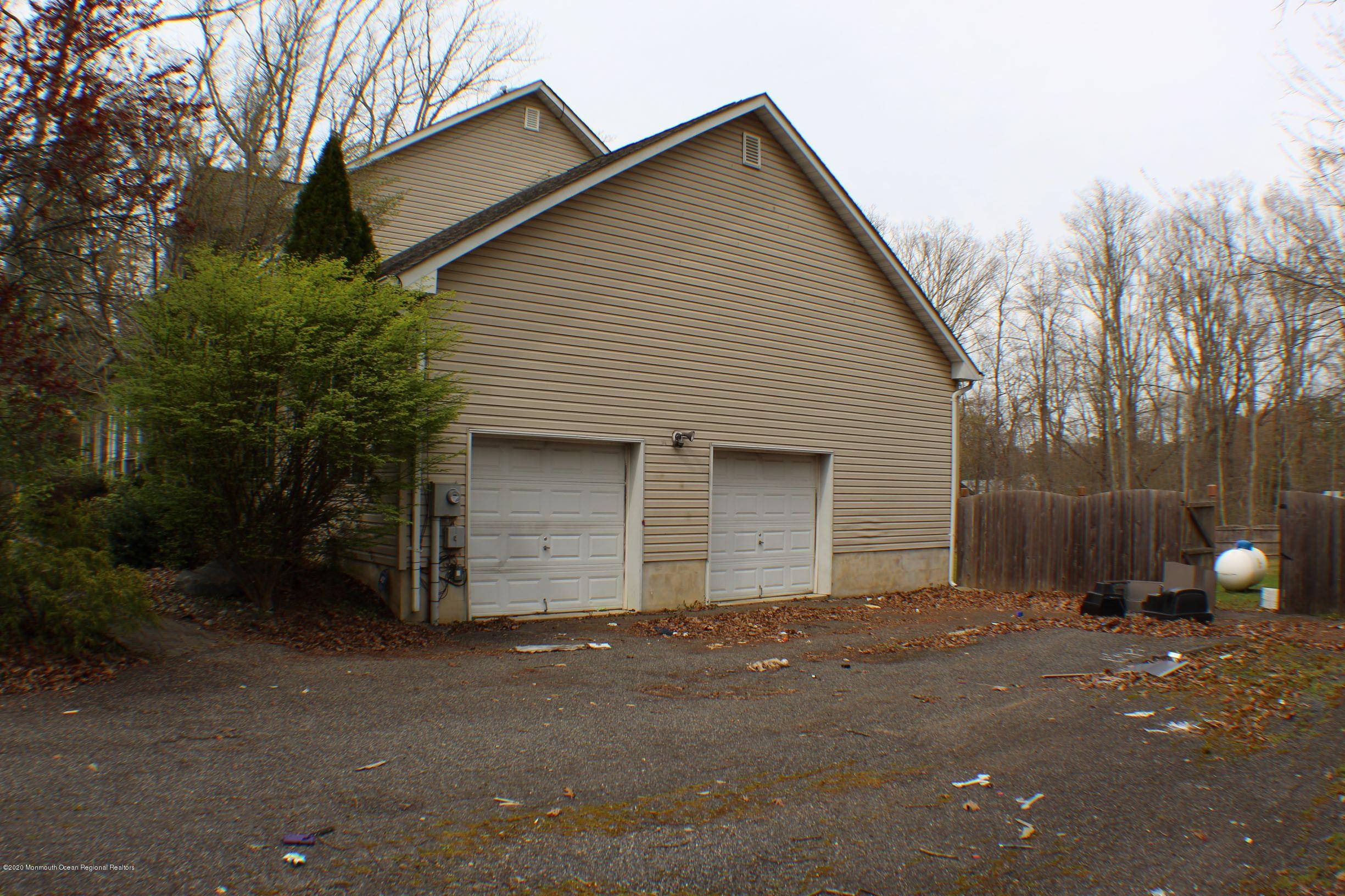 211 Cassville Road Jackson, NJ 08527 - Photo 47 of 58 a front view of house with yard and trees