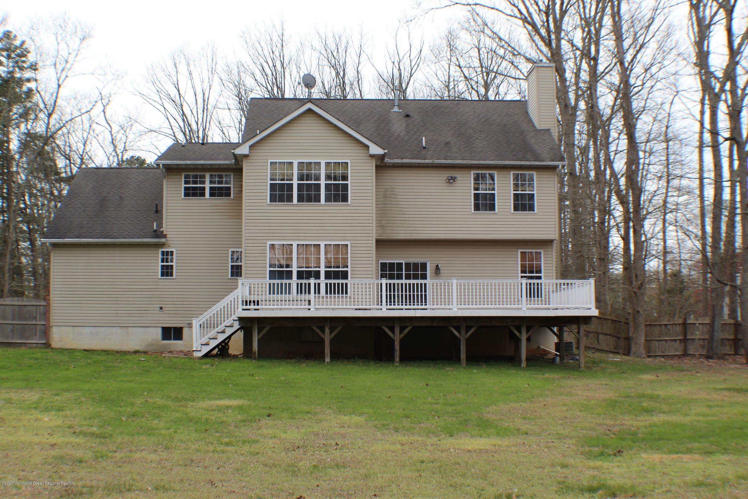 211 Cassville Road Jackson, NJ 08527 - Photo 48 of 58 a view of a house with backyard and a tree