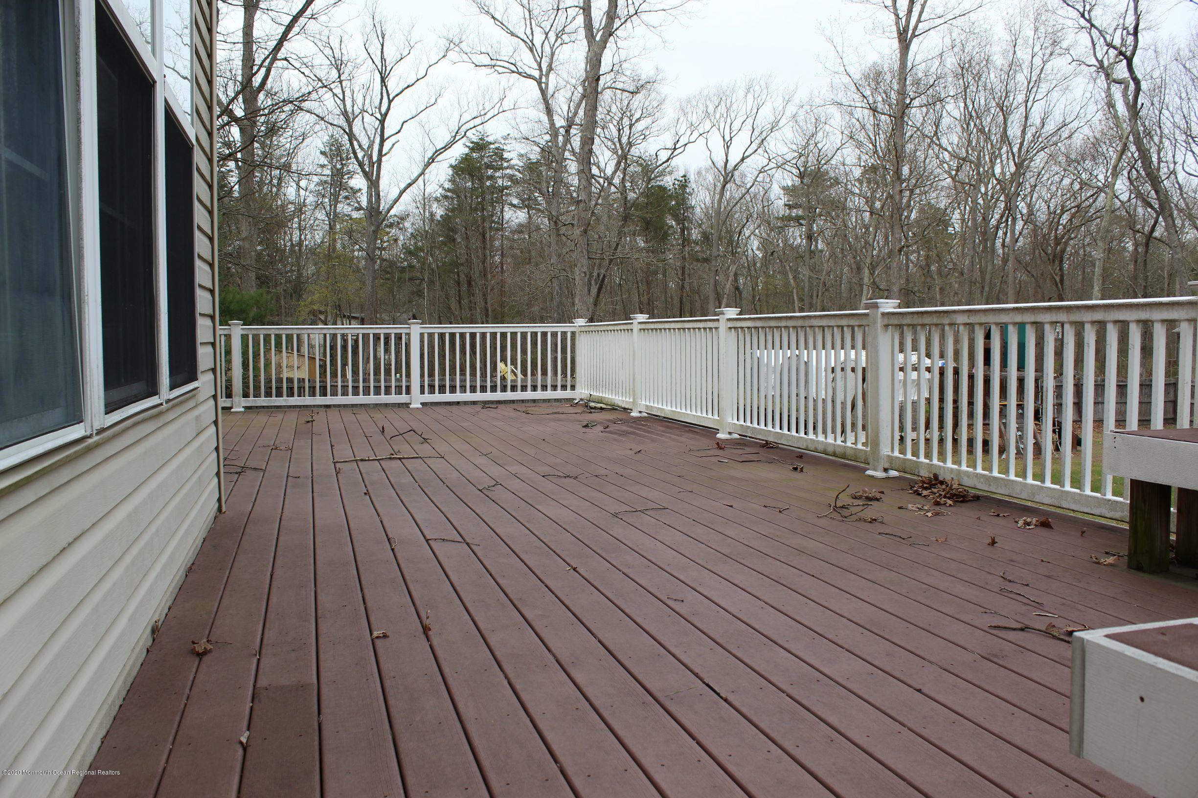 211 Cassville Road Jackson, NJ 08527 - Photo 49 of 58 a view of deck with wooden floor and fence