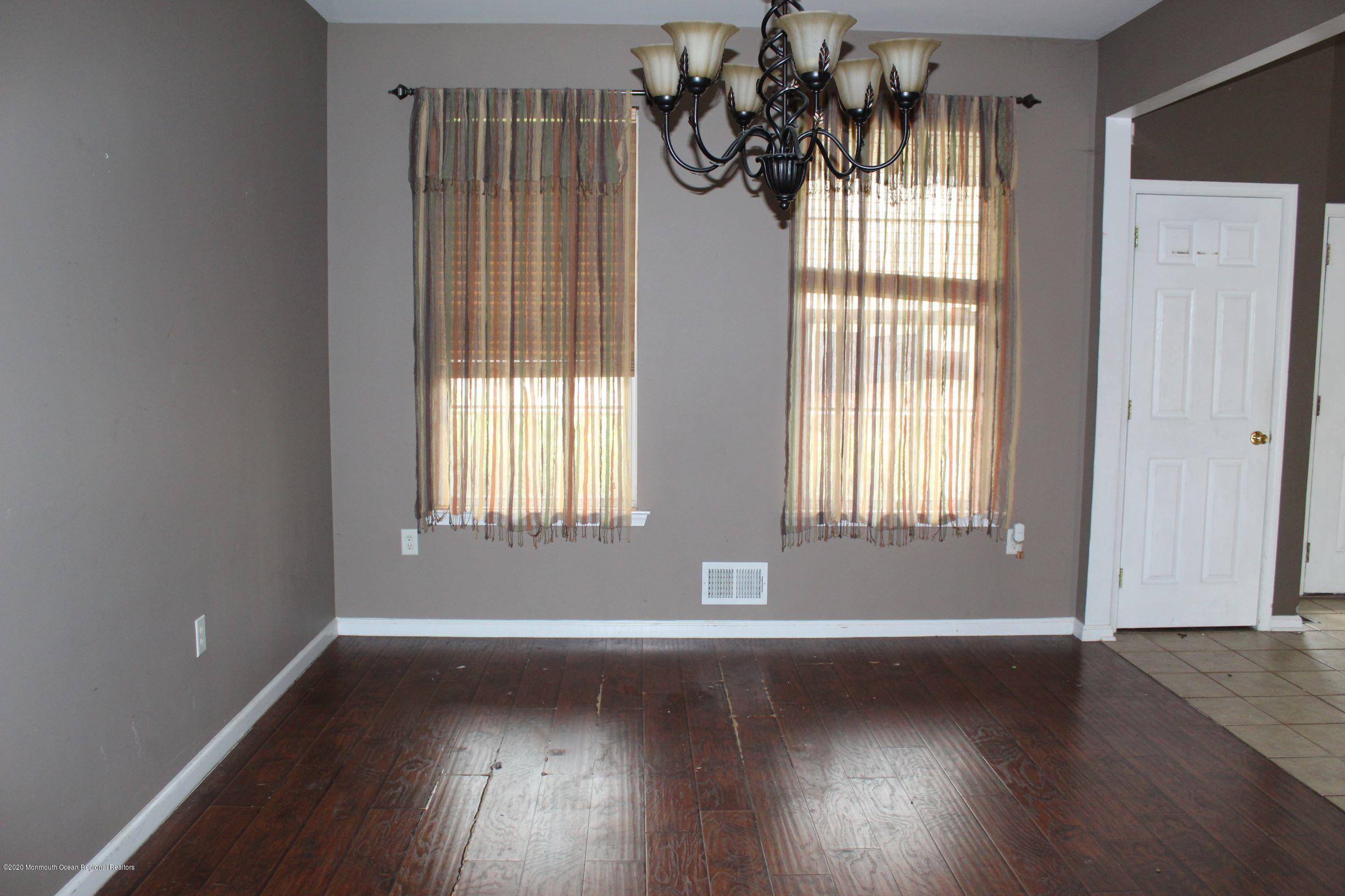 211 Cassville Road Jackson, NJ 08527 - Photo 9 of 58 a view of wooden floor and windows in a room