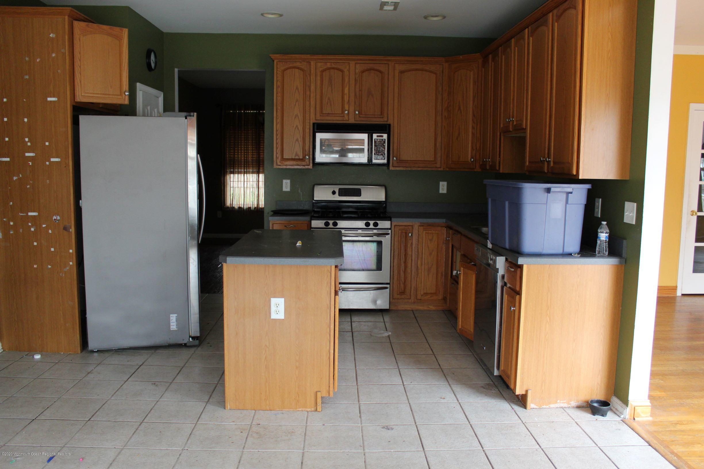 211 Cassville Road Jackson, NJ 08527 - Photo 10 of 58 a kitchen with stainless steel appliances granite countertop a refrigerator and a stove