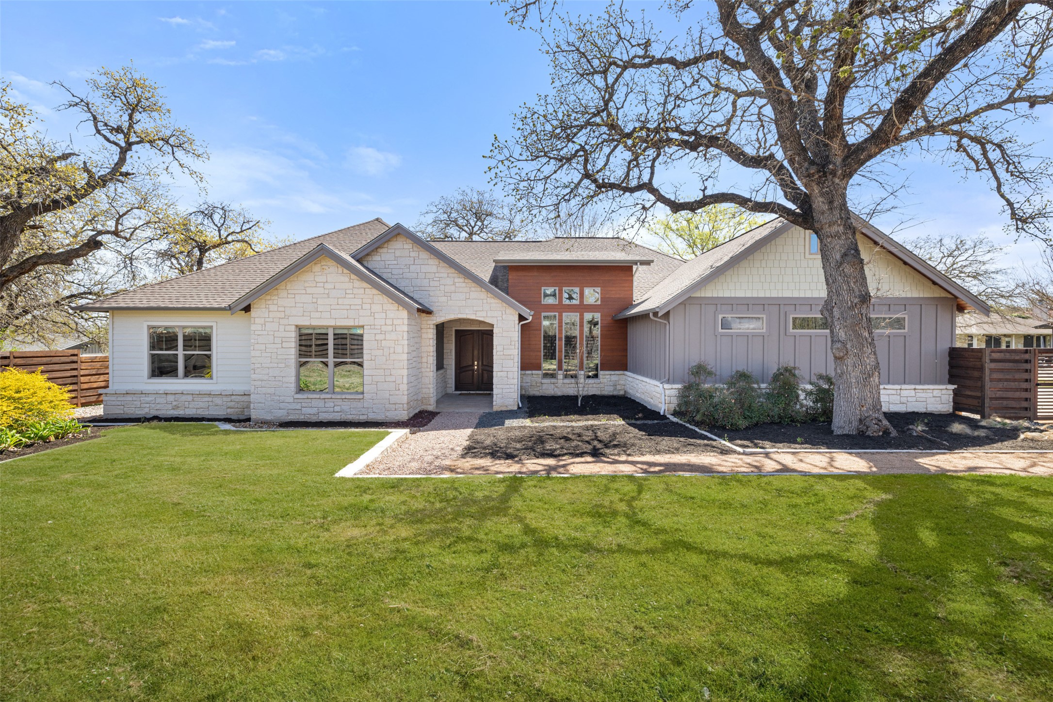 a front view of a house with a yard
