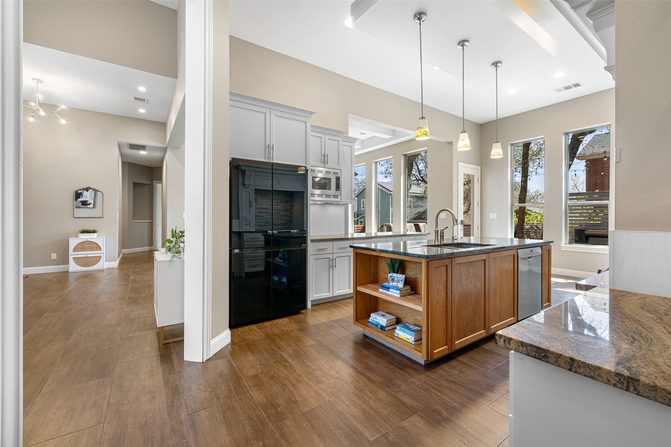 1017 South Quinlan Park Road Austin, TX 78732 - Photo 11 of 39 a kitchen with stainless steel appliances a refrigerator and a stove top oven