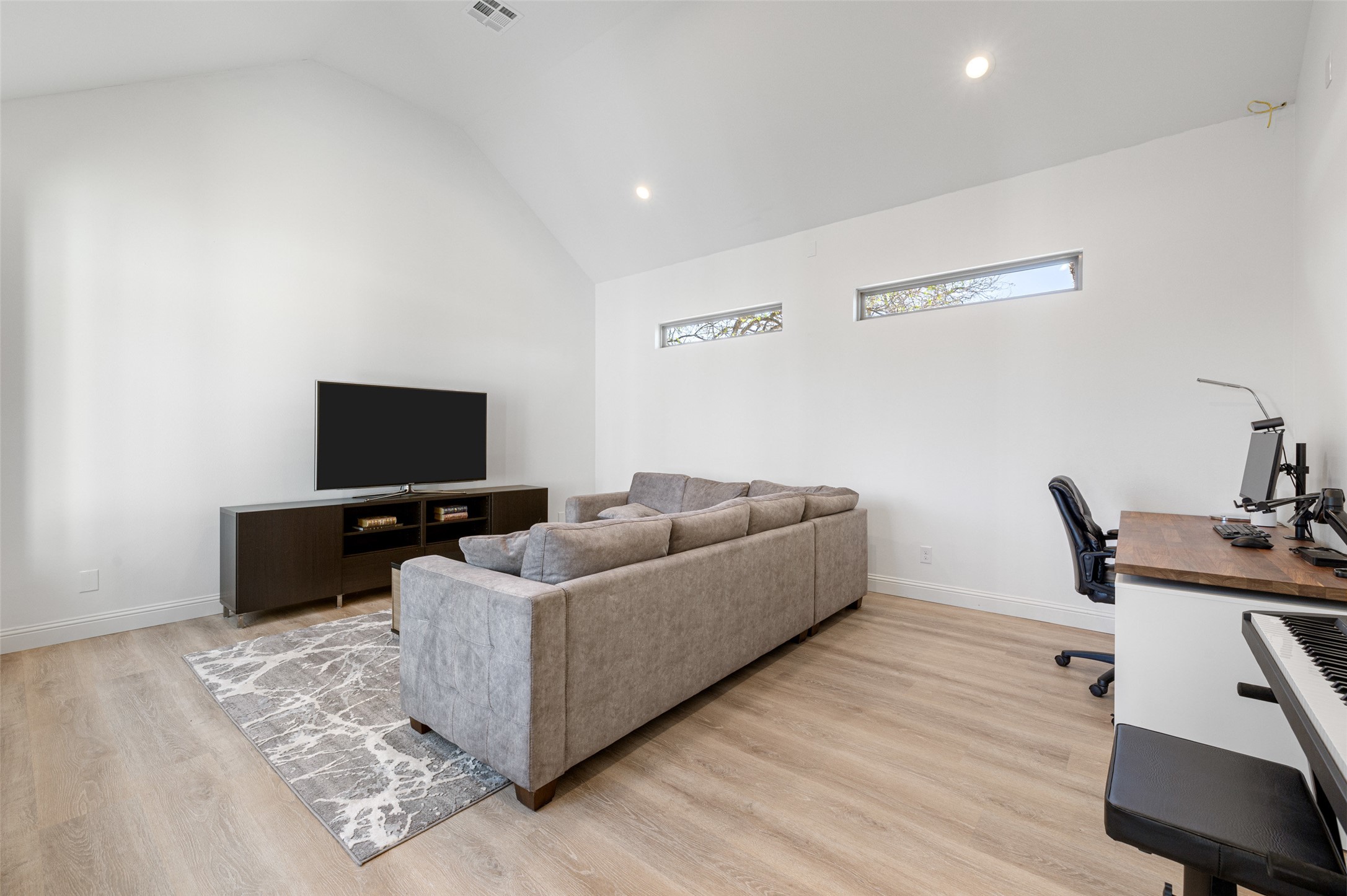 1017 South Quinlan Park Road Austin, TX 78732 - Photo 20 of 39 a living room with furniture and a flat screen tv