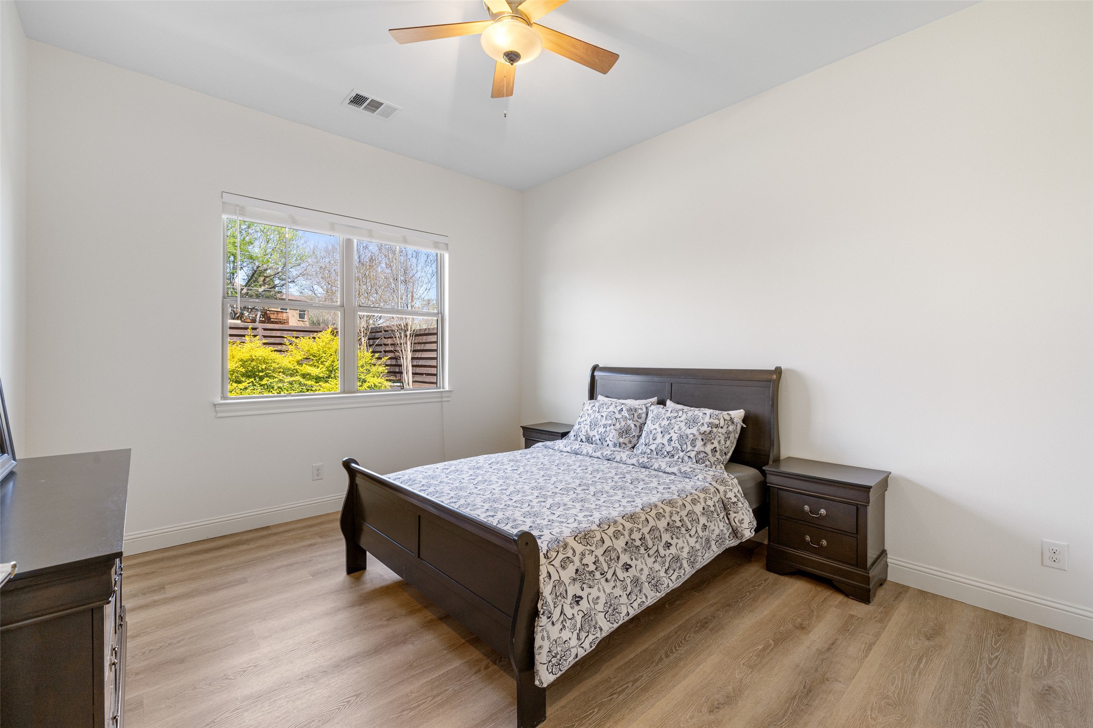 1017 South Quinlan Park Road Austin, TX 78732 - Photo 23 of 39 a bedroom with a bed and a window