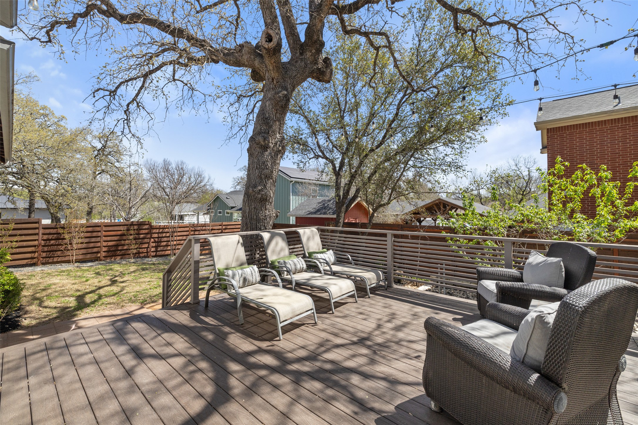 1017 South Quinlan Park Road Austin, TX 78732 - Photo 27 of 39 a balcony with couch and trees