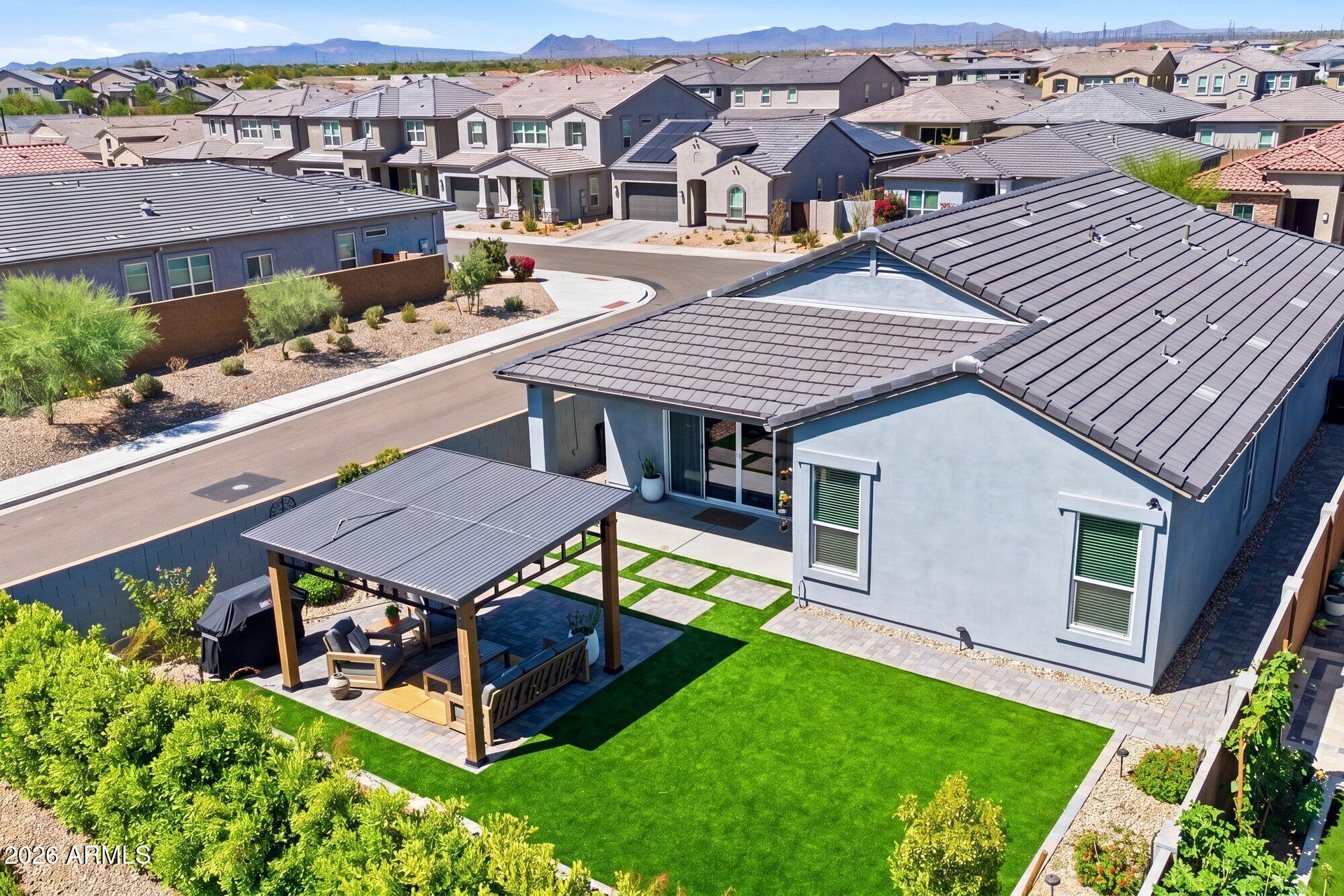 5963 East Lone Cactus Road Phoenix, AZ 85054 - Photo 3 of 22 an aerial view of a house with a yard