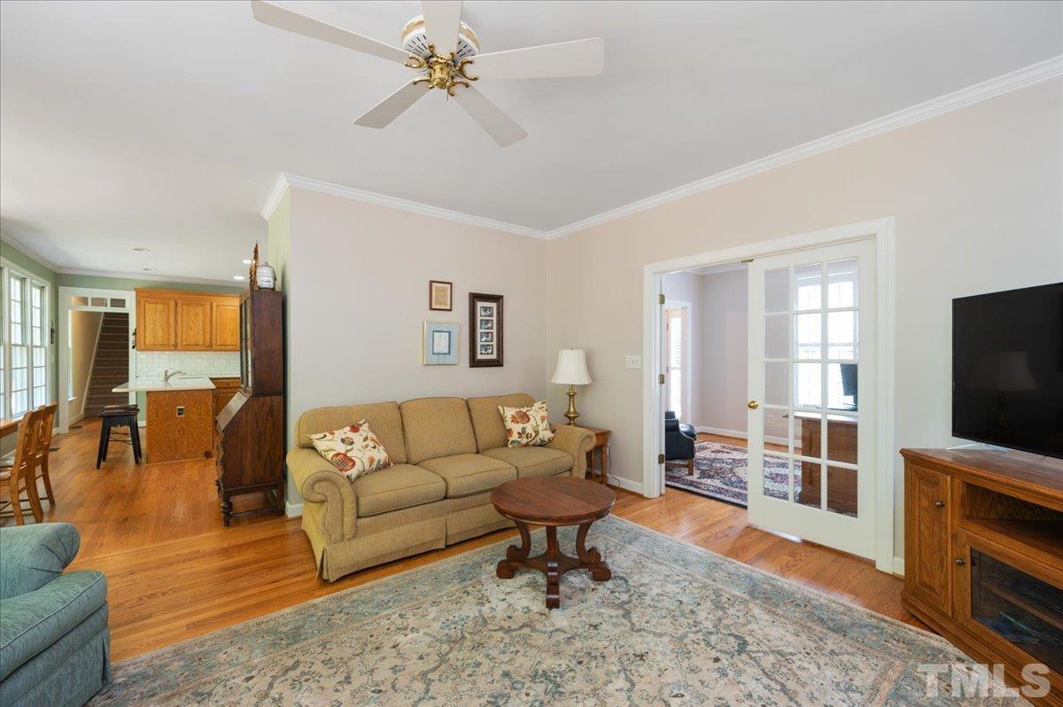 7025 Spring Ridge Road Cary, NC 27518 - Photo 11 of 35 a living room with furniture and a flat screen tv