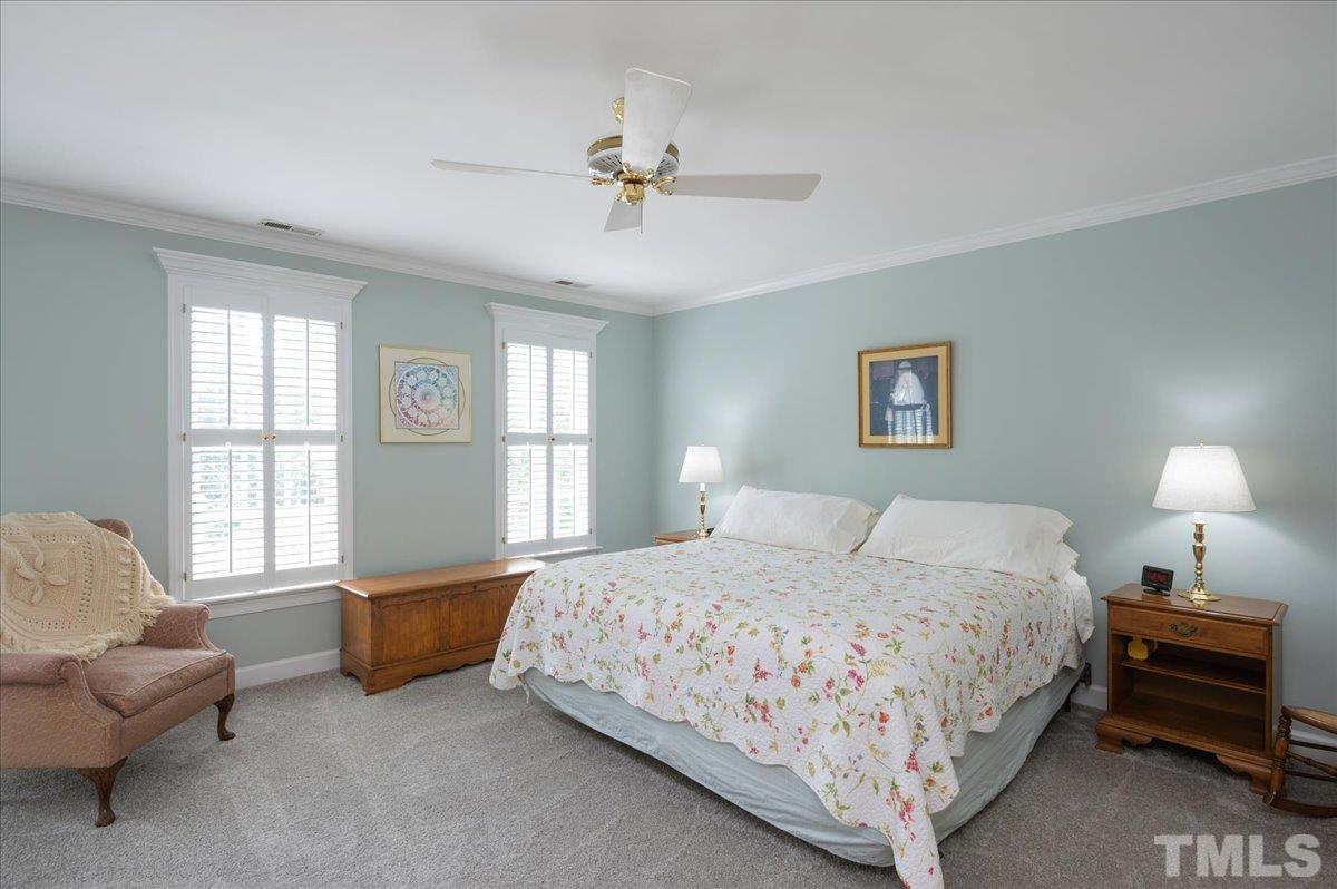 7025 Spring Ridge Road Cary, NC 27518 - Photo 18 of 35 a bedroom with a bed and a couch