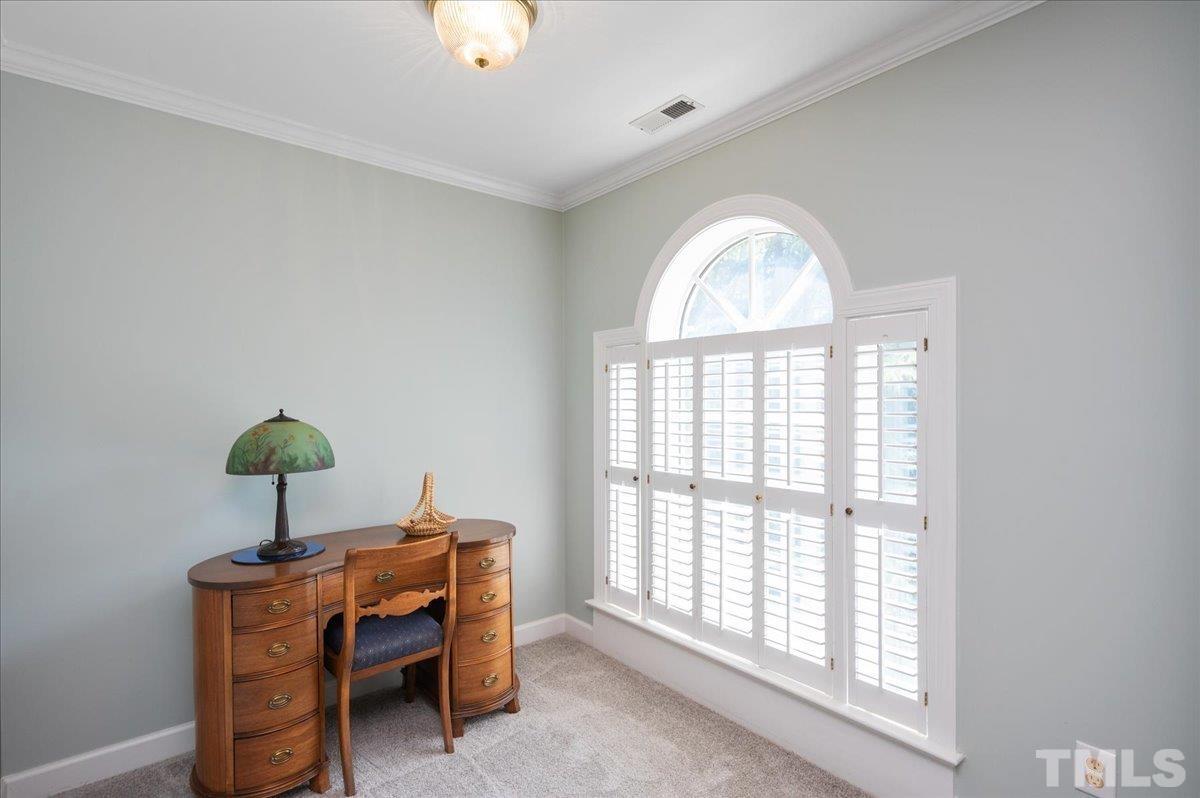 7025 Spring Ridge Road Cary, NC 27518 - Photo 20 of 35 a view of a livingroom with a window and a chandelier
