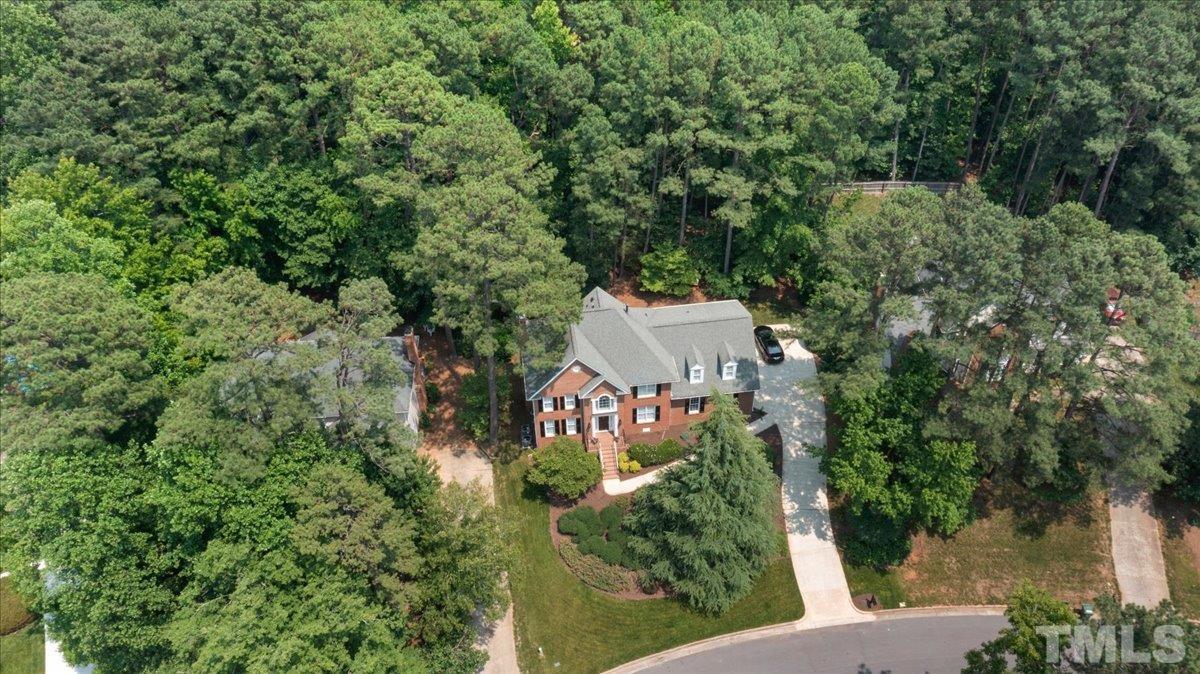 7025 Spring Ridge Road Cary, NC 27518 - Photo 2 of 35 view of a house with a yard and trees