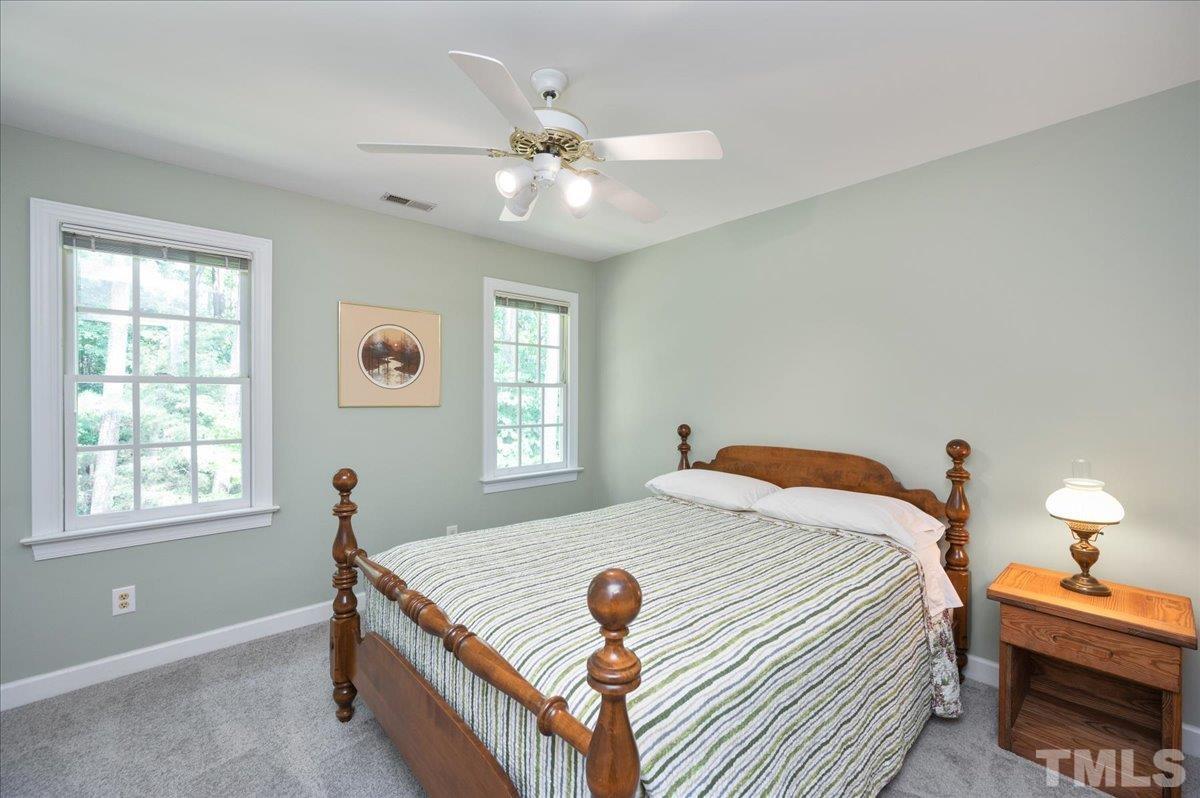7025 Spring Ridge Road Cary, NC 27518 - Photo 25 of 35 a bedroom with a bed and window