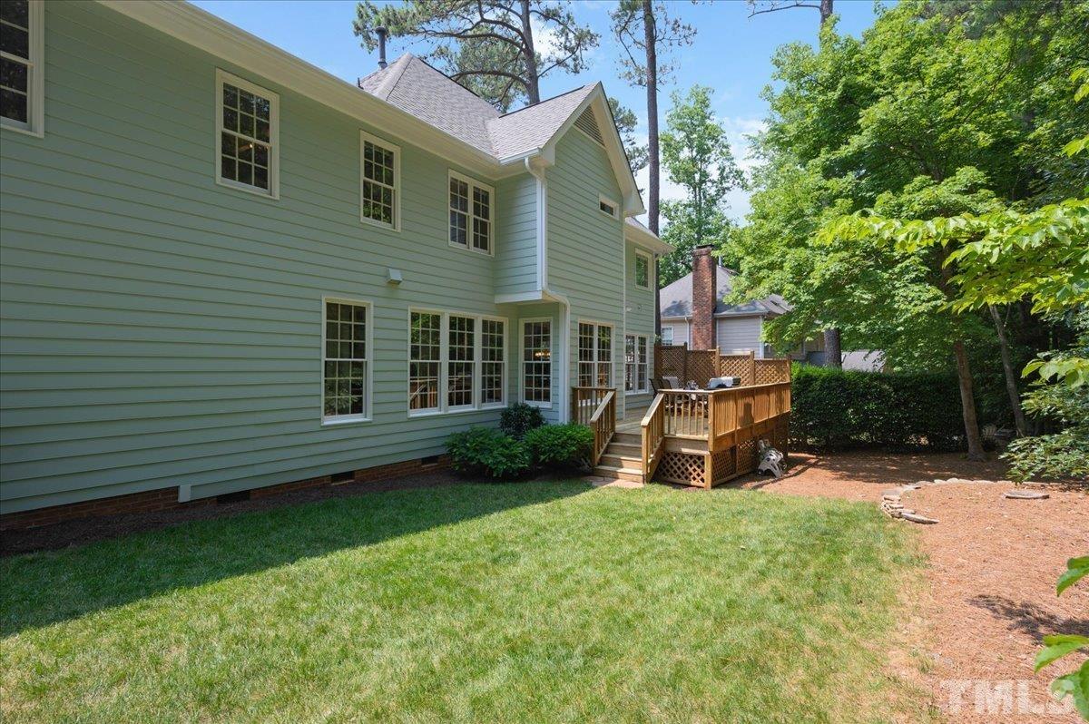 7025 Spring Ridge Road Cary, NC 27518 - Photo 31 of 35 a view of a house with a yard porch and sitting area