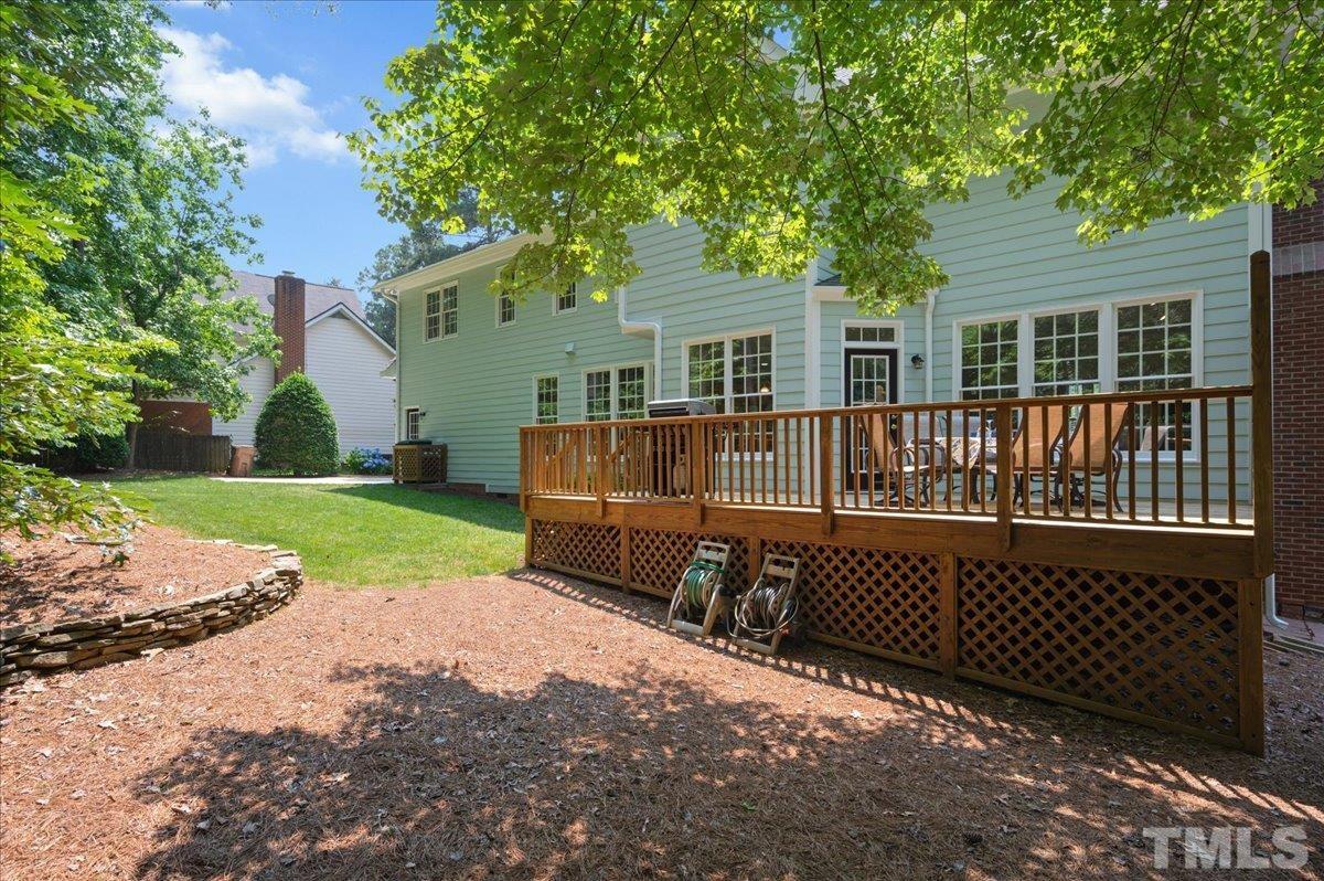 7025 Spring Ridge Road Cary, NC 27518 - Photo 32 of 35 a view of a house with a yard