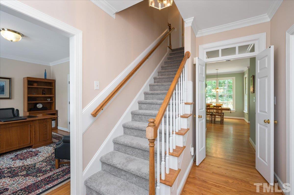 7025 Spring Ridge Road Cary, NC 27518 - Photo 4 of 35 a view of entryway and hall with wooden floor