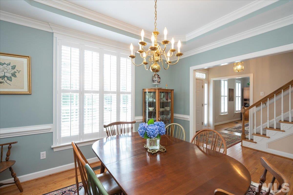 7025 Spring Ridge Road Cary, NC 27518 - Photo 6 of 35 a view of a dining room with furniture window and wooden floor