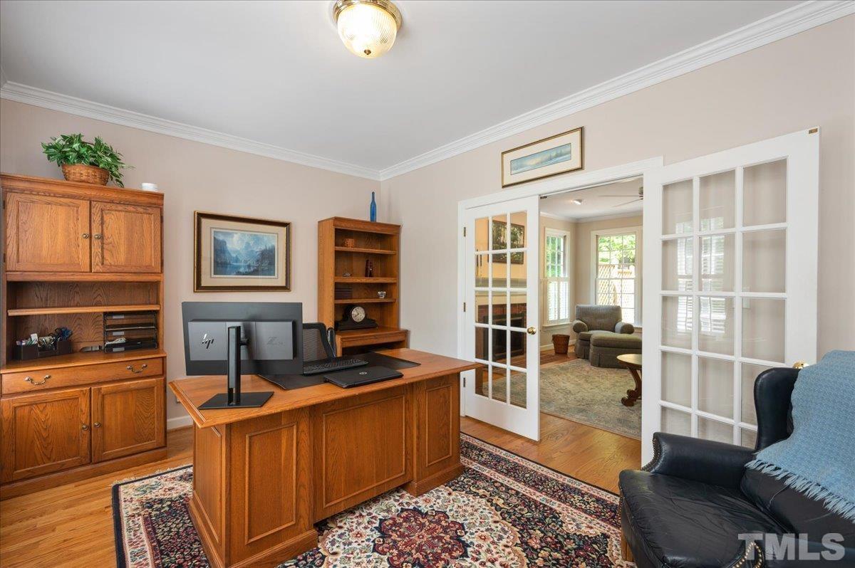 7025 Spring Ridge Road Cary, NC 27518 - Photo 7 of 35 a living room with furniture and a floor to ceiling window