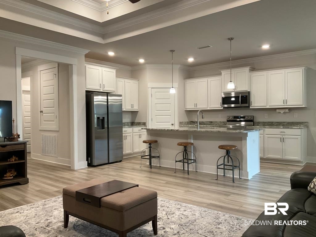 1093 Pheasant Circle Foley, AL 36535 - Photo 6 of 25 Living room with ornamental molding, recessed lighting, light wood-style floors, and a ceiling fan