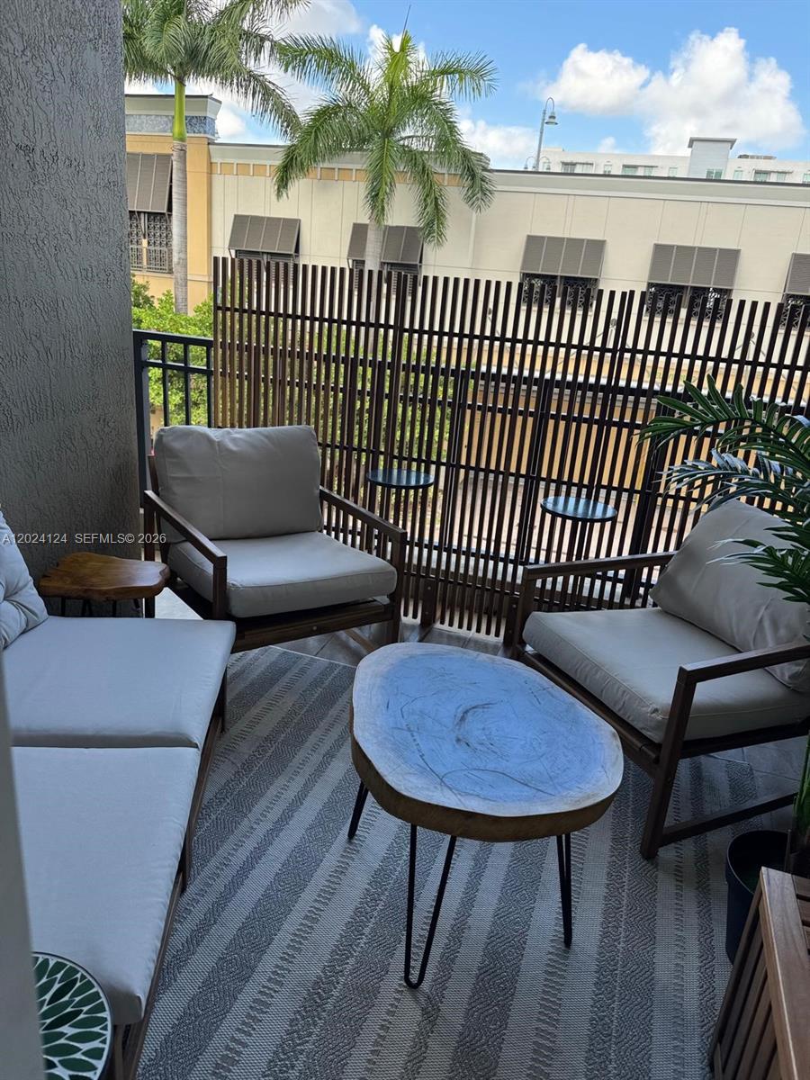 120 South Douglas Road, Unit 302 Miami, FL 33134 - Photo 24 of 28 a view of a chairs in patio of the house