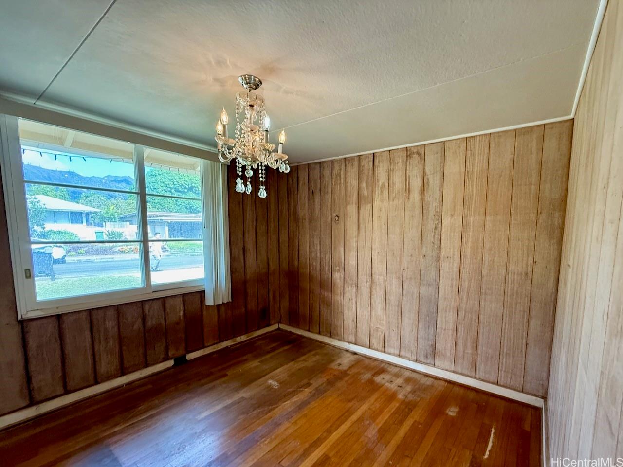 5265 Manauwea Street Honolulu, HI 96821 - Photo 11 of 24 a view of an empty room with wooden floor and a window