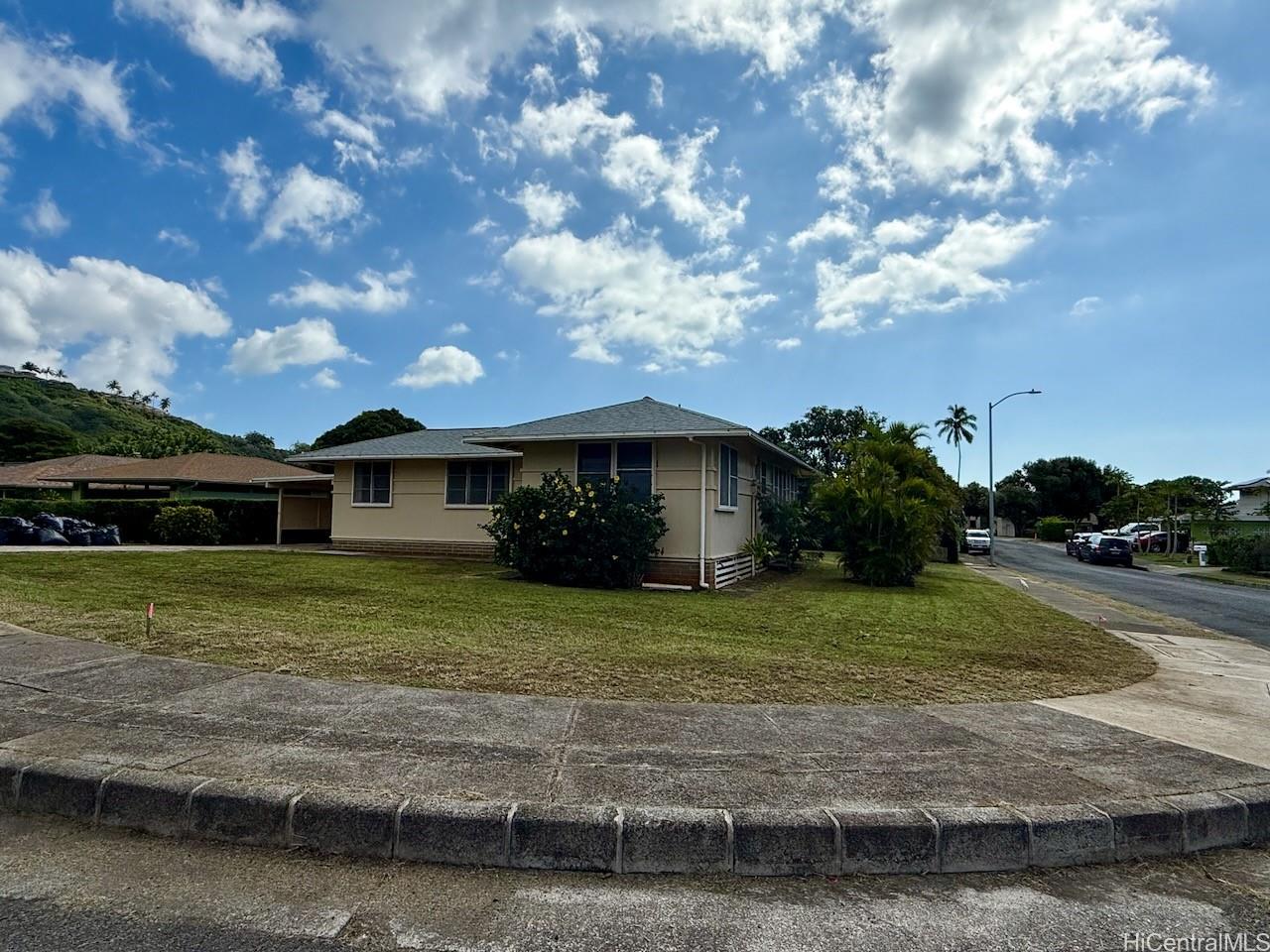 5265 Manauwea Street Honolulu, HI 96821 - Photo 22 of 24 a front view of a house with a garden