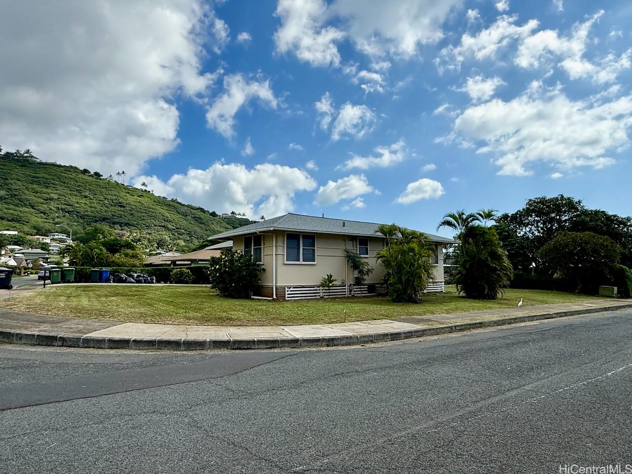 5265 Manauwea Street Honolulu, HI 96821 - Photo 23 of 24 a view of a house with a big yard and large trees