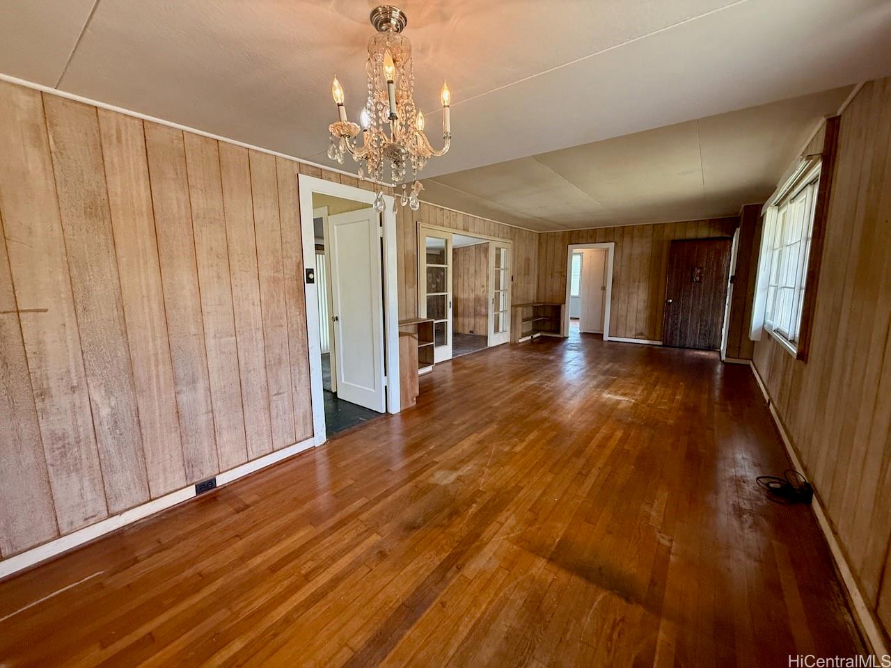 5265 Manauwea Street Honolulu, HI 96821 - Photo 5 of 24 a view of a room with wooden floor