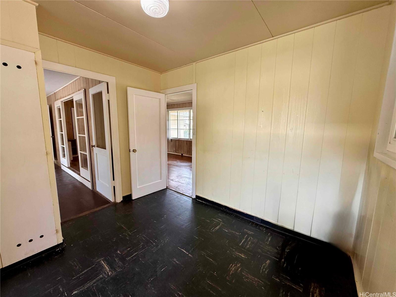 5265 Manauwea Street Honolulu, HI 96821 - Photo 8 of 24 a view of a hallway with wooden floor