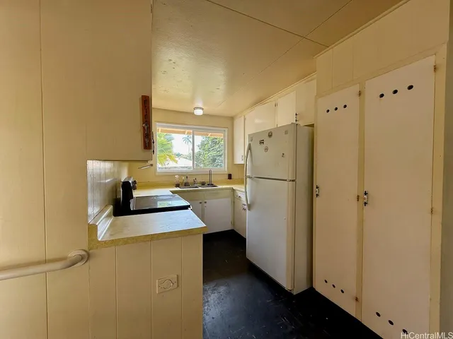 a kitchen with a refrigerator a sink and dishwasher