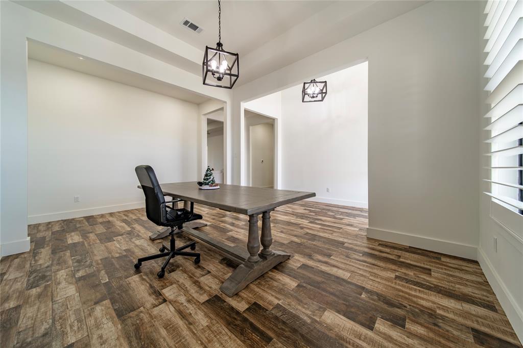 165 Ranch House Road Rockwall, TX 75032 - Photo 15 of 40 a view of a workspace with furniture window and wooden floor