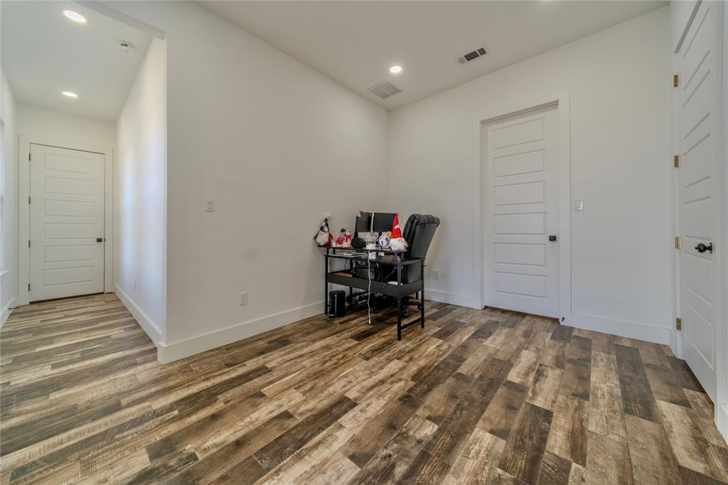165 Ranch House Road Rockwall, TX 75032 - Photo 24 of 40 a view of a room with a table and a chair
