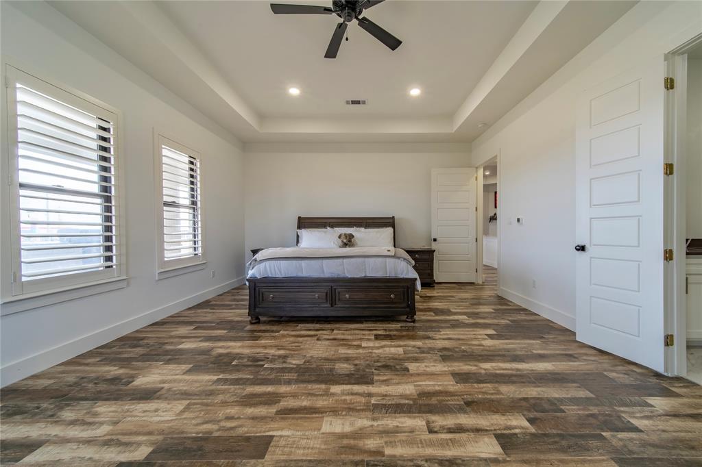 165 Ranch House Road Rockwall, TX 75032 - Photo 25 of 40 a bedroom with a bed and window