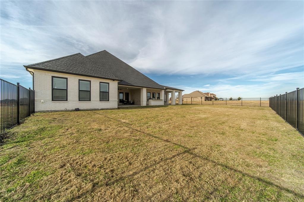 165 Ranch House Road Rockwall, TX 75032 - Photo 36 of 40 a front view of a house with a yard